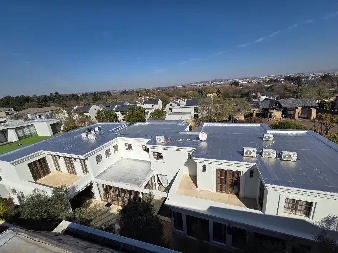 Waterproofed flat commercial roof seen from above