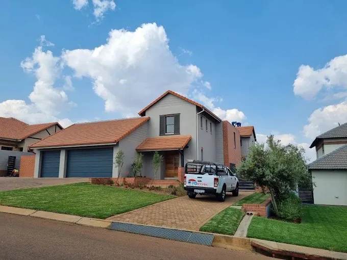 FD Roofing bakkie parked at a client's home